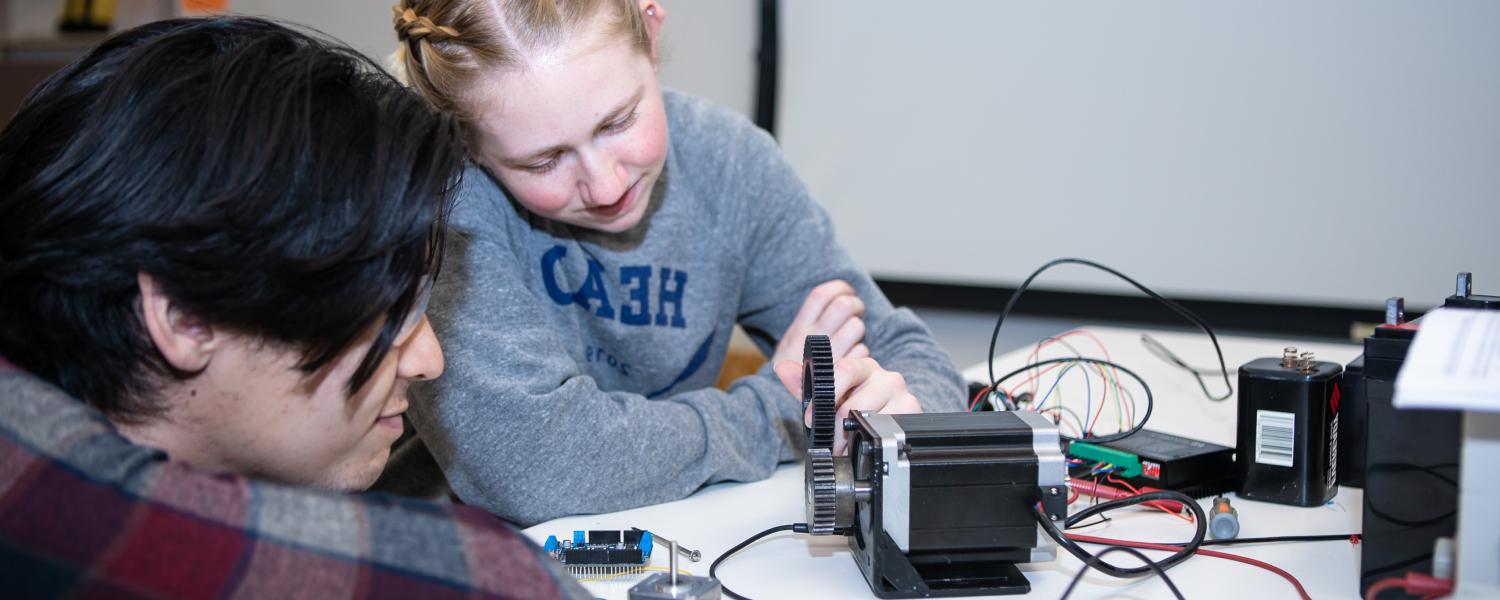 Two engineering students at SPU work together on a project.